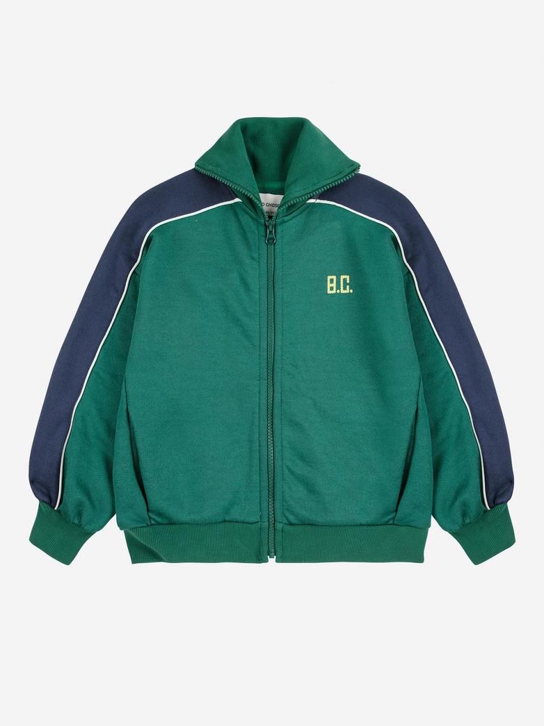 Green and navy jacket with 'B.C.' logo on a white background