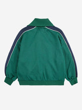 Load image into Gallery viewer, Green jacket with navy accents on a white background